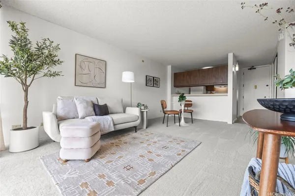 a living room with furniture and a table