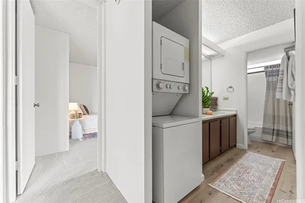 a hallway with washer and dryer