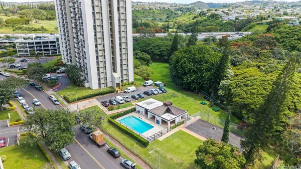 an aerial view of a house with swimming pool garden and patio