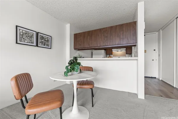 a dining room with furniture and window