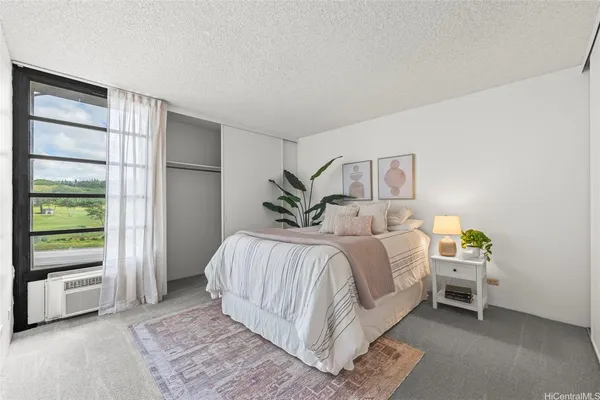 a bed room with a bed and a window