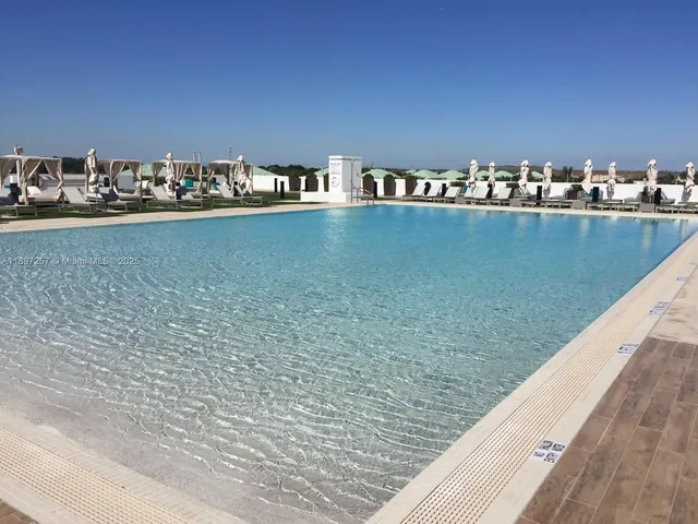 a view of swimming pool with a yard