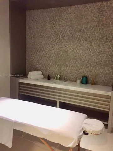 a room with gym equipment and a window