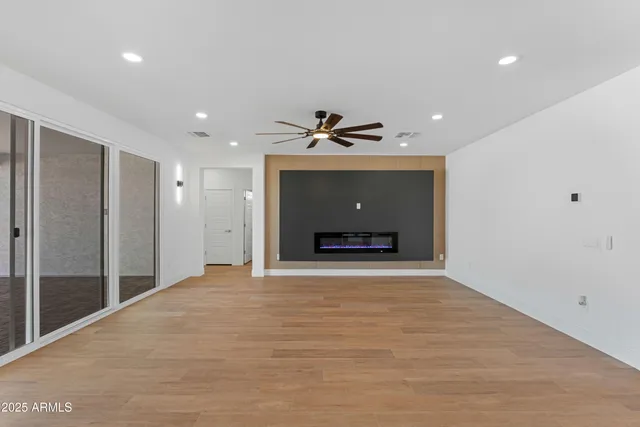 a living room with a couch and a table with wooden floor