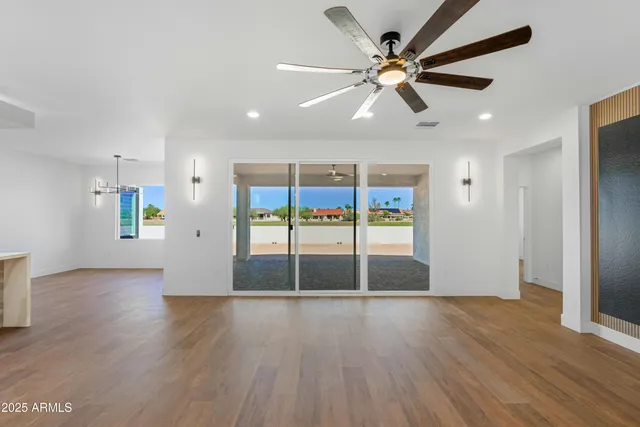 a view of a livingroom with furniture and wooden floor