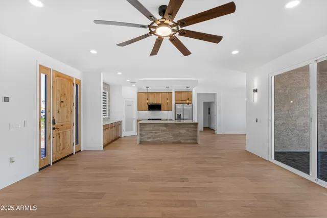 a bathroom with a shower and a glass door