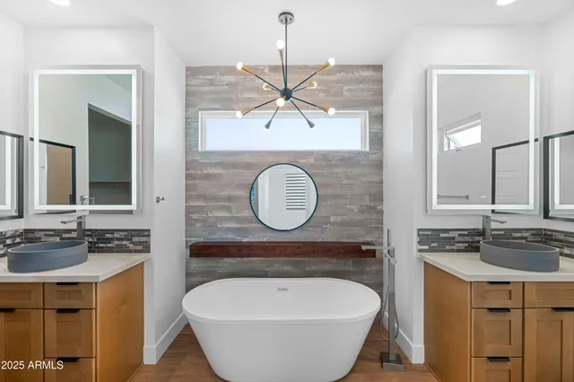 a bathroom with a sink toilet and mirror