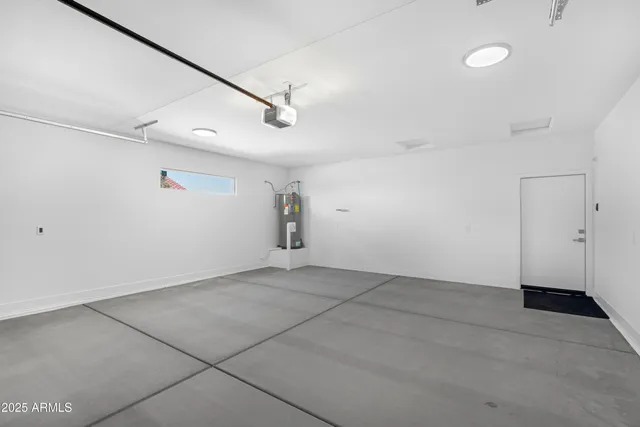 a view of washer and dryer with wooden floor