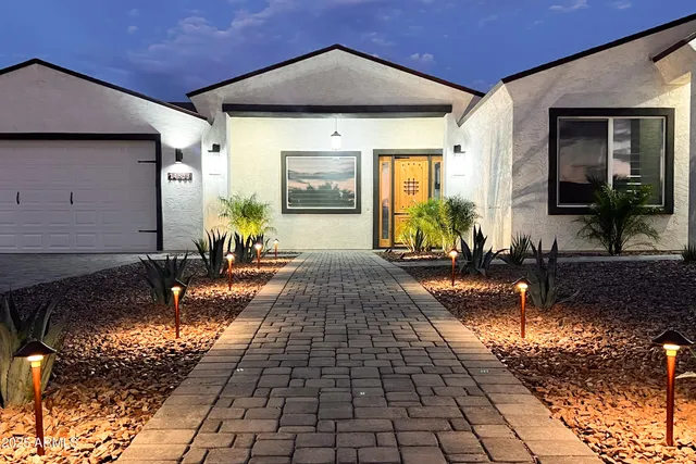 a front view of a house with garden