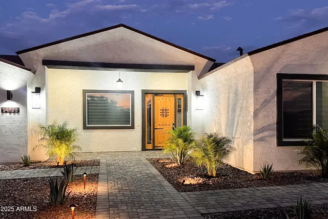 a kitchen with a sink a counter top space stainless steel appliances and cabinets
