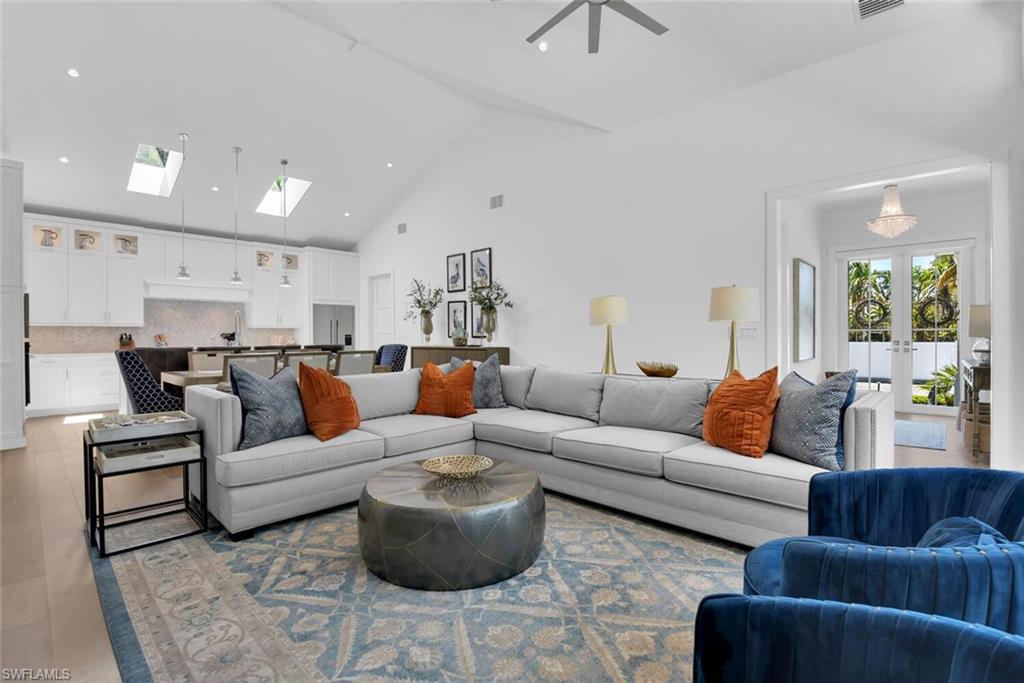 2130 Curtis Street Naples, FL 34112 - Photo 9 of 31 a living room with furniture and a large window