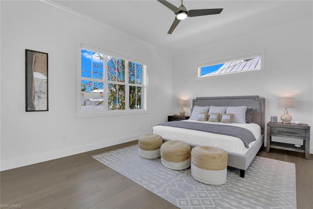 2130 Curtis Street Naples, FL 34112 - Photo 17 of 31 a bedroom with a bed and wooden floor