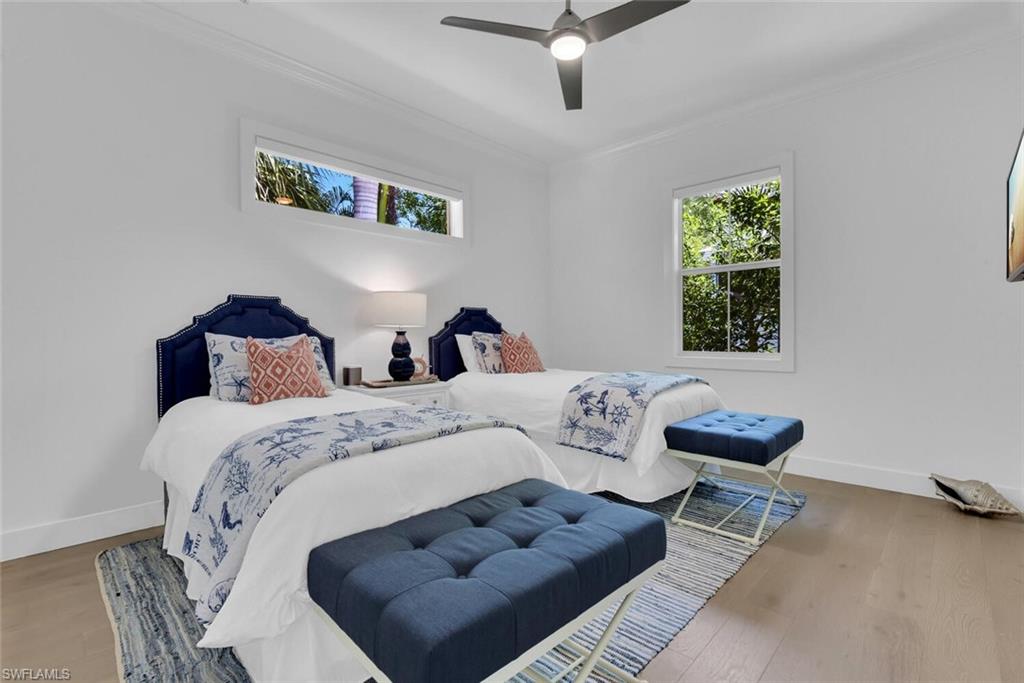 2130 Curtis Street Naples, FL 34112 - Photo 21 of 31 a bed room with bed and a couch