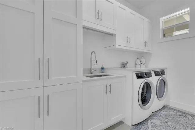 a bathroom with a sink a large mirror and a shower