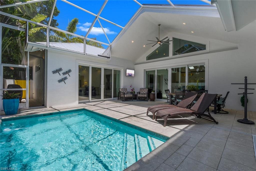 2130 Curtis Street Naples, FL 34112 - Photo 25 of 31 a view of a patio with table and chairs near a barbeque