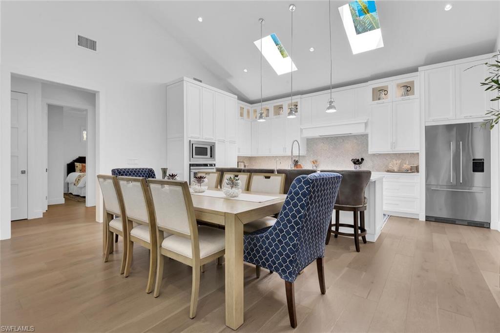 2130 Curtis Street Naples, FL 34112 - Photo 6 of 31 a dining room with furniture and wooden floor