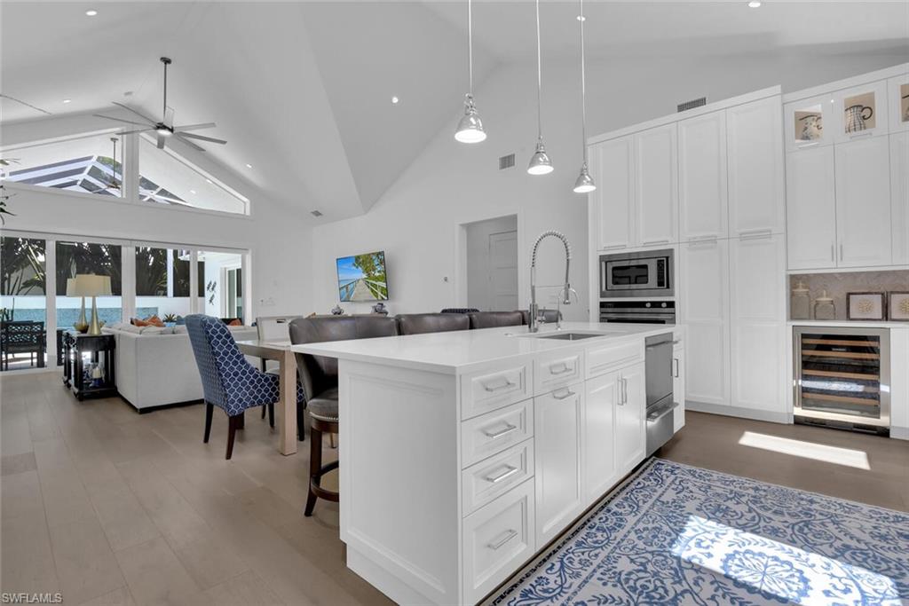 2130 Curtis Street Naples, FL 34112 - Photo 30 of 31 a large white kitchen with lots of counter space