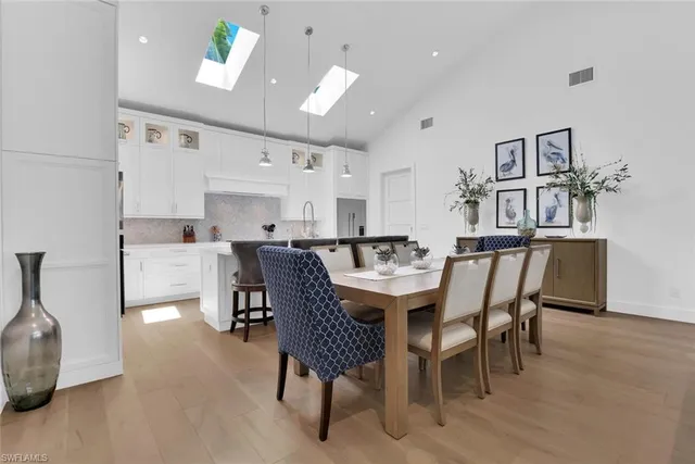 a large white kitchen with lots of counter space