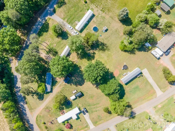 an aerial view of a house with a yard and garden