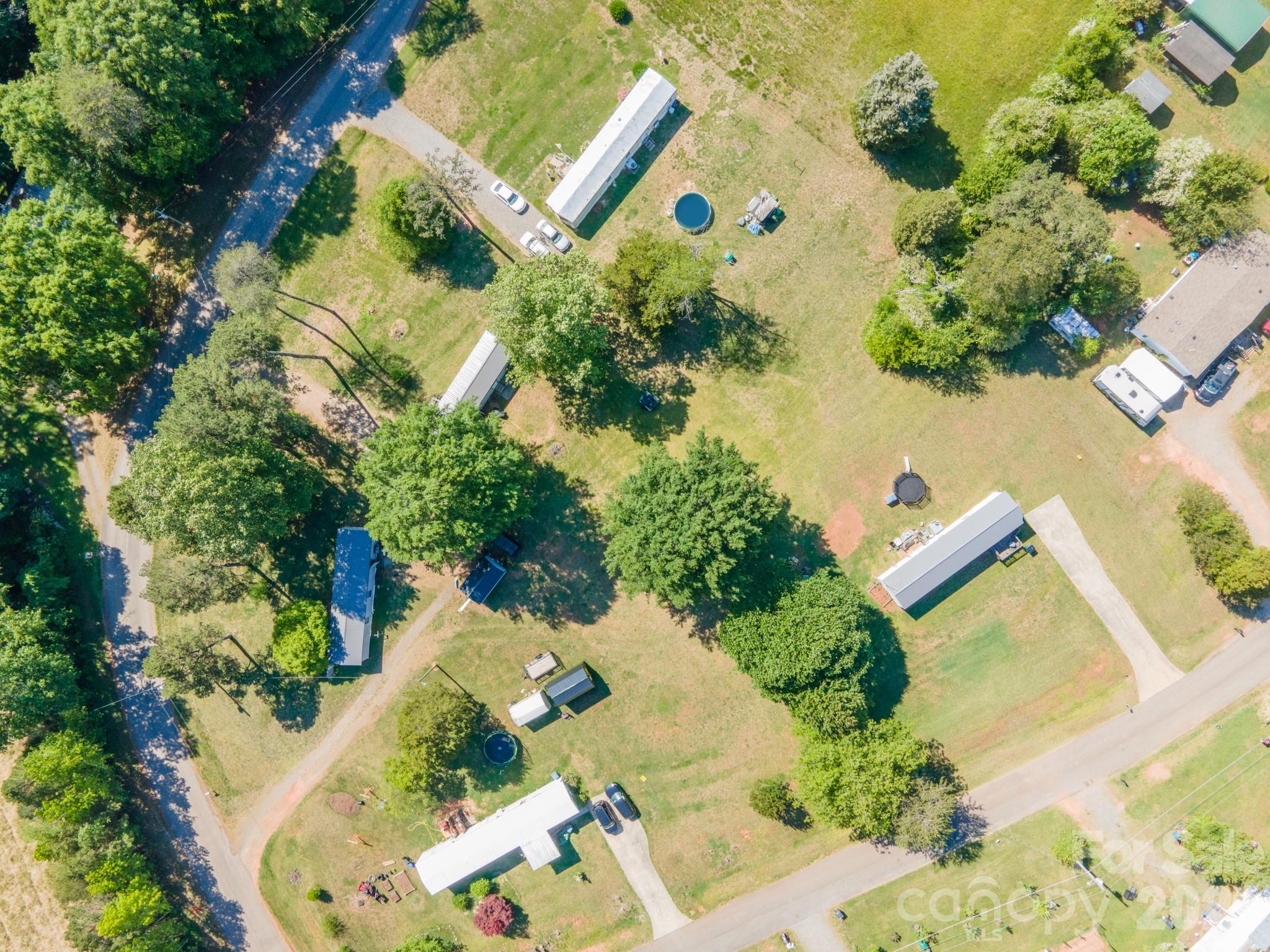 an aerial view of a house with a yard and garden