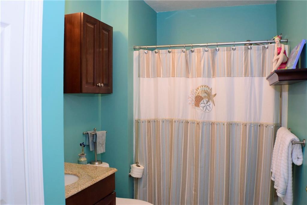 22 Kavanaugh Road Old Orchard Beach, ME 04064 - Photo 21 of 33 Bathroom with tub adjacent to second...