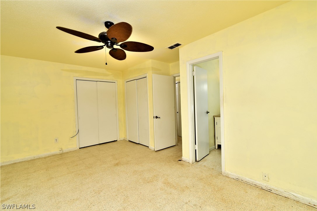 502 Wyoming Road Lehigh Acres, FL 33936 - Photo 12 of 20 a view of empty room with wooden floor