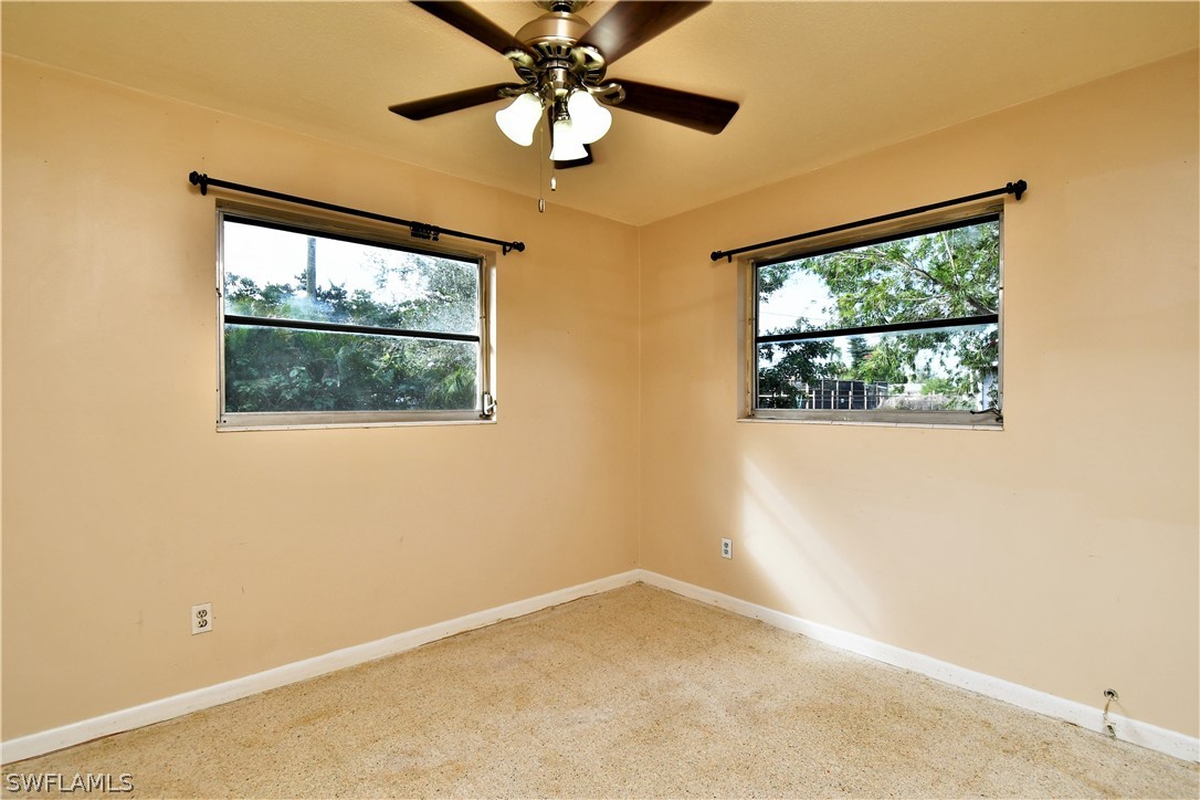 502 Wyoming Road Lehigh Acres, FL 33936 - Photo 14 of 20 an empty room with a window