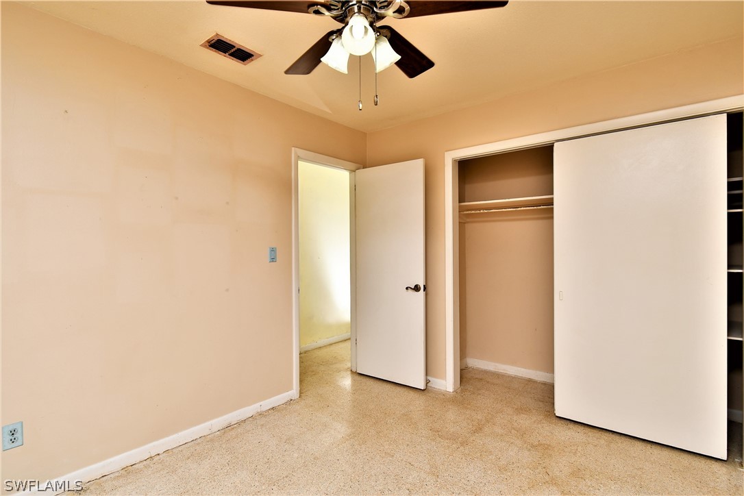 502 Wyoming Road Lehigh Acres, FL 33936 - Photo 15 of 20 a view of empty room with ceiling fan