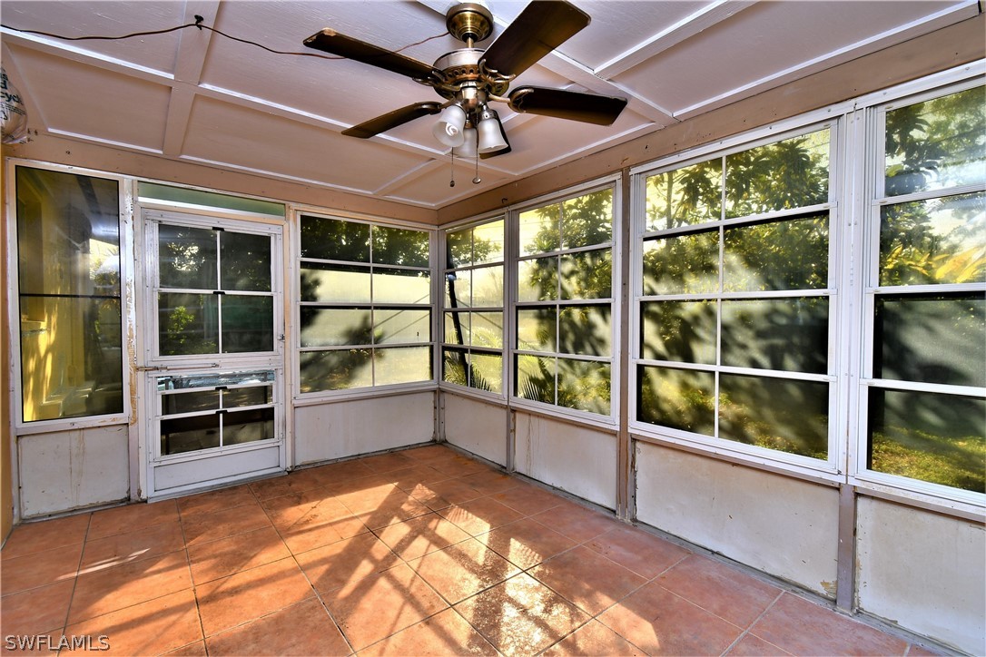 502 Wyoming Road Lehigh Acres, FL 33936 - Photo 18 of 20 a view of a kitchen with furniture and a window