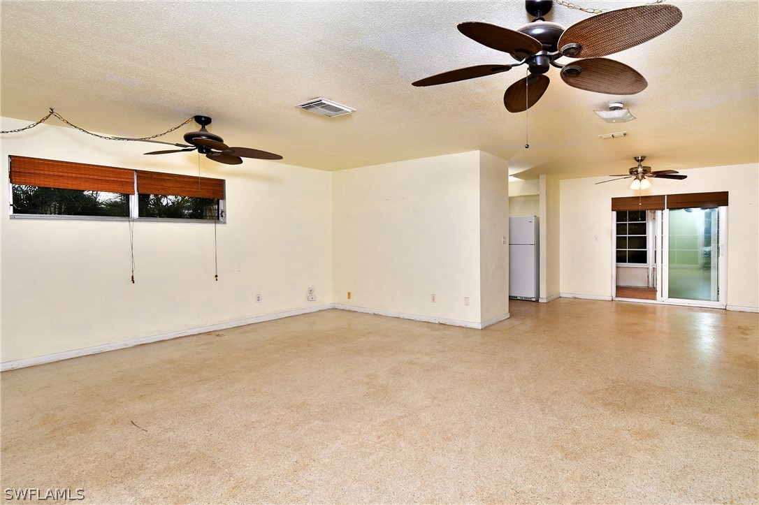 502 Wyoming Road Lehigh Acres, FL 33936 - Photo 4 of 20 a view of a ceiling fan and a window