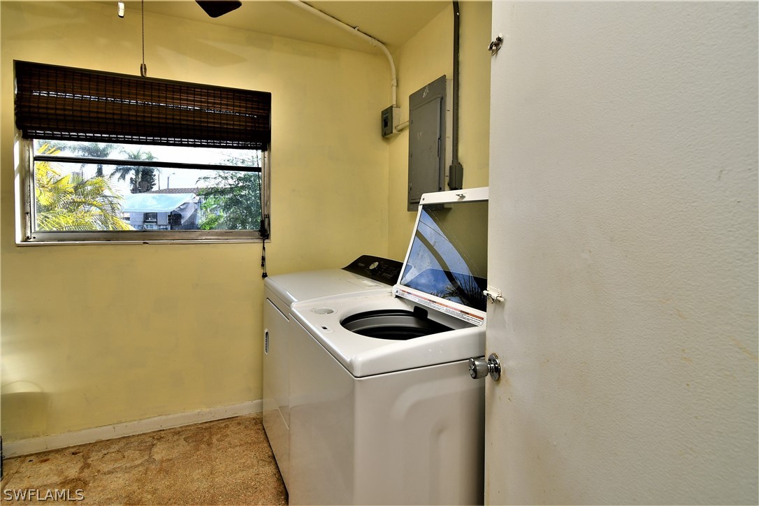 502 Wyoming Road Lehigh Acres, FL 33936 - Photo 10 of 20 a room with storage and utility