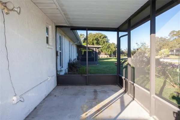 a view of a house with backyard and garden