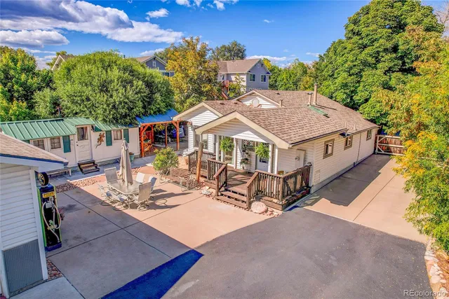 a view of house with yard outdoor seating and green space