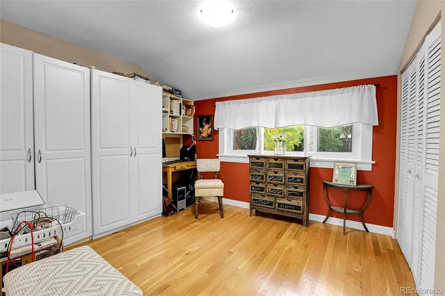 a bedroom with furniture and a window