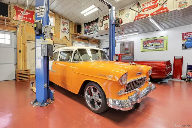 a blue and white bed sitting in a room next to a building