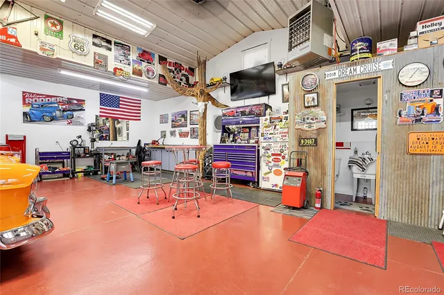 a living room with lots of furniture and a flat screen tv