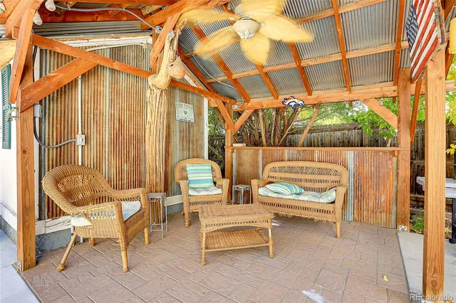 a outdoor living space with patio furniture and a fireplace