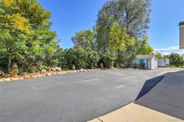 a view of a house with a yard and garage