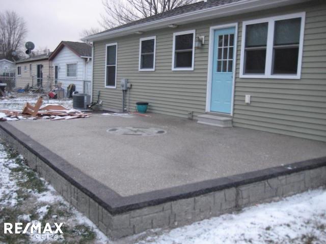 406 North Lester Street Capac, MI 48014 - Photo 2 of 25 REAR EXPOESED PATIO