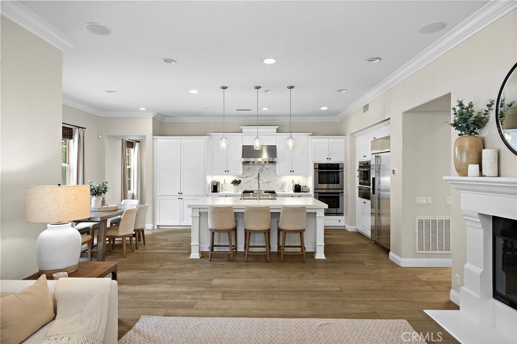 7 Julia Street Ladera Ranch, CA 92694 - Photo 14 of 52 a living room with furniture a dining table and kitchen view