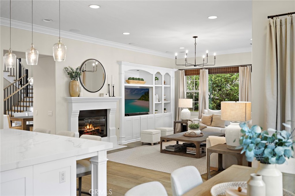 7 Julia Street Ladera Ranch, CA 92694 - Photo 20 of 52 a living room with furniture a fireplace and a floor to ceiling window