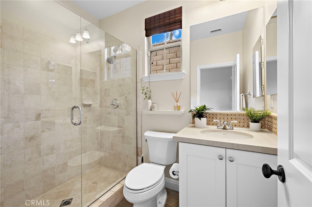 7 Julia Street Ladera Ranch, CA 92694 - Photo 21 of 52 a bathroom with a sink a toilet and shower
