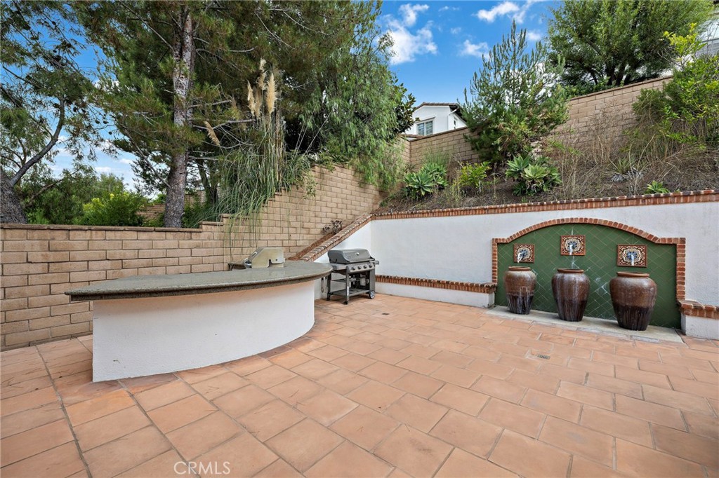 7 Julia Street Ladera Ranch, CA 92694 - Photo 24 of 52 a view of a wooden fence and a pathway of a house