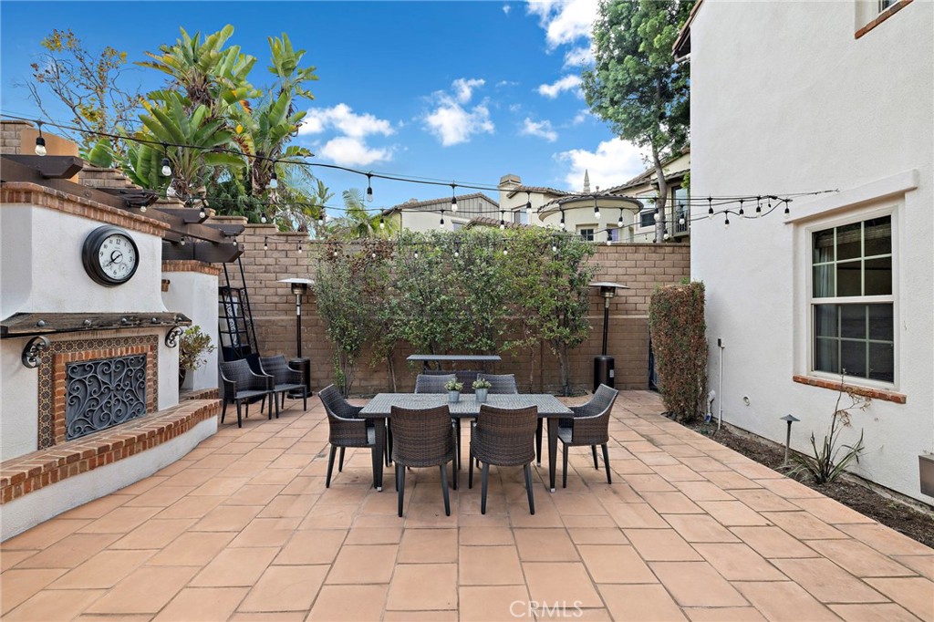 7 Julia Street Ladera Ranch, CA 92694 - Photo 26 of 52 a view of a patio with table and chairs with a potted plants