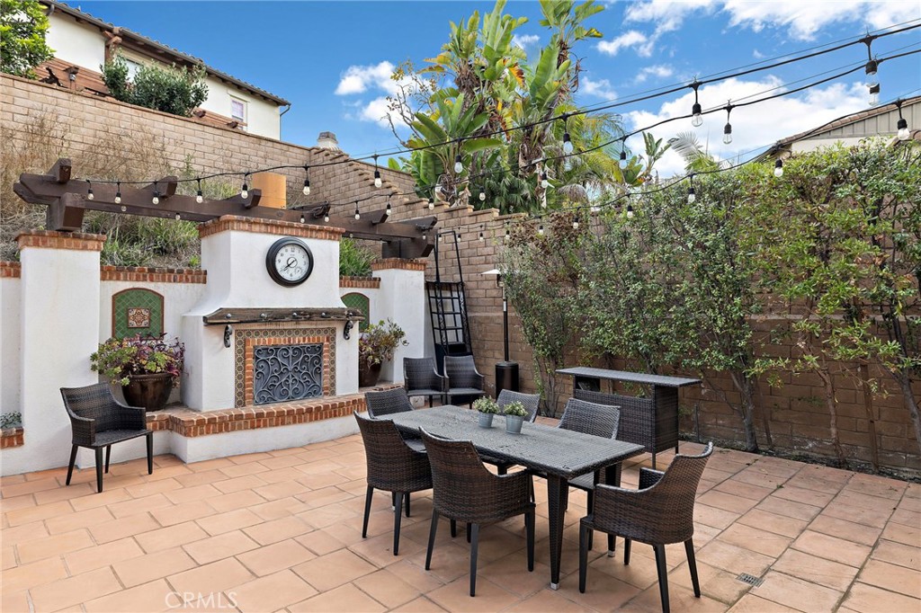 7 Julia Street Ladera Ranch, CA 92694 - Photo 27 of 52 a table and chairs in a patio