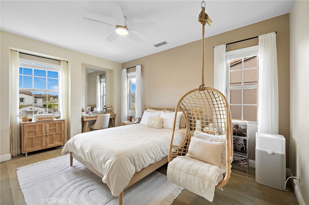 7 Julia Street Ladera Ranch, CA 92694 - Photo 32 of 52 a bedroom with a bed and wooden floor