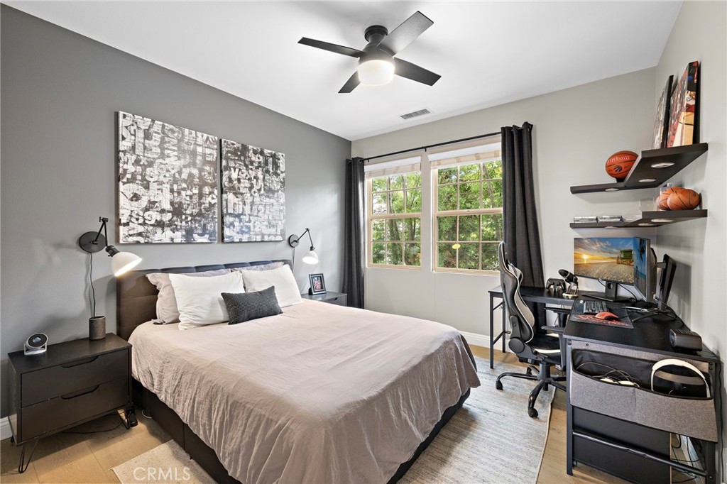 7 Julia Street Ladera Ranch, CA 92694 - Photo 37 of 52 a bedroom with a bed a large window with table and chairs