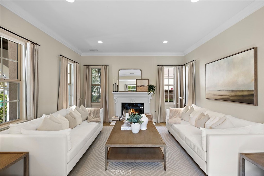 7 Julia Street Ladera Ranch, CA 92694 - Photo 4 of 52 a living room with furniture and a fireplace