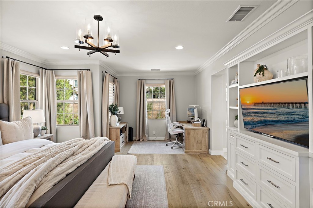 7 Julia Street Ladera Ranch, CA 92694 - Photo 43 of 52 a bedroom with a bed and glass windows