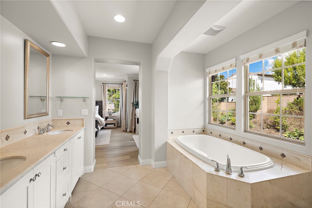 7 Julia Street Ladera Ranch, CA 92694 - Photo 46 of 52 a large spacious bathroom with a large tub and sink